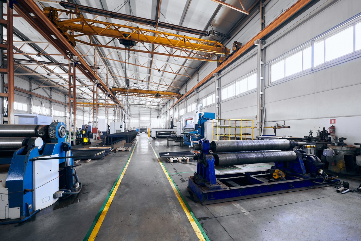 Plate bending rolls in a metal workshop