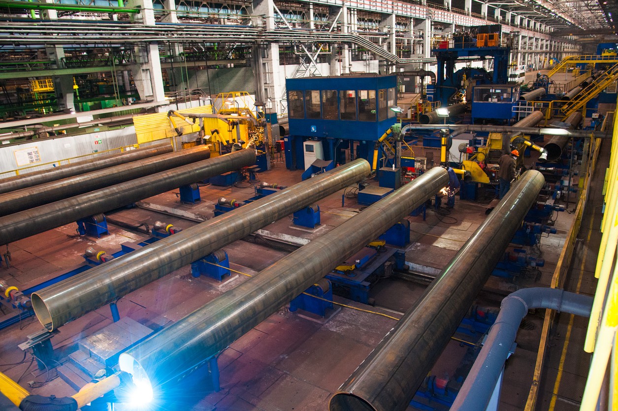 Steel pipe mill on a factory floor